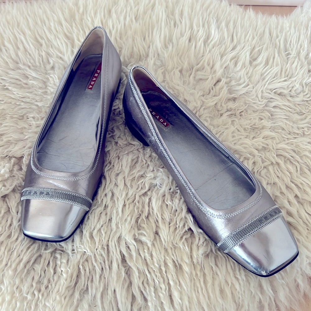 Prada silver pump with walking sole.